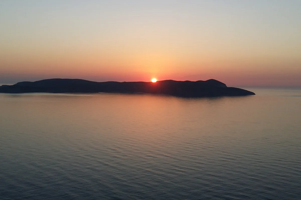 Sunset over the island of Psara, Greece — the kind of trip a maximized refund can book